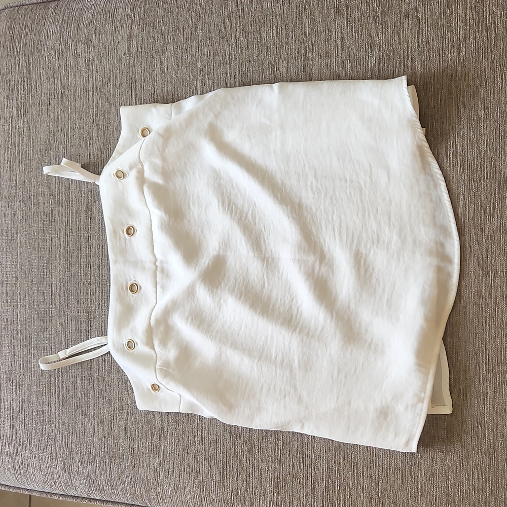 White top adjustable straps polyester lining.